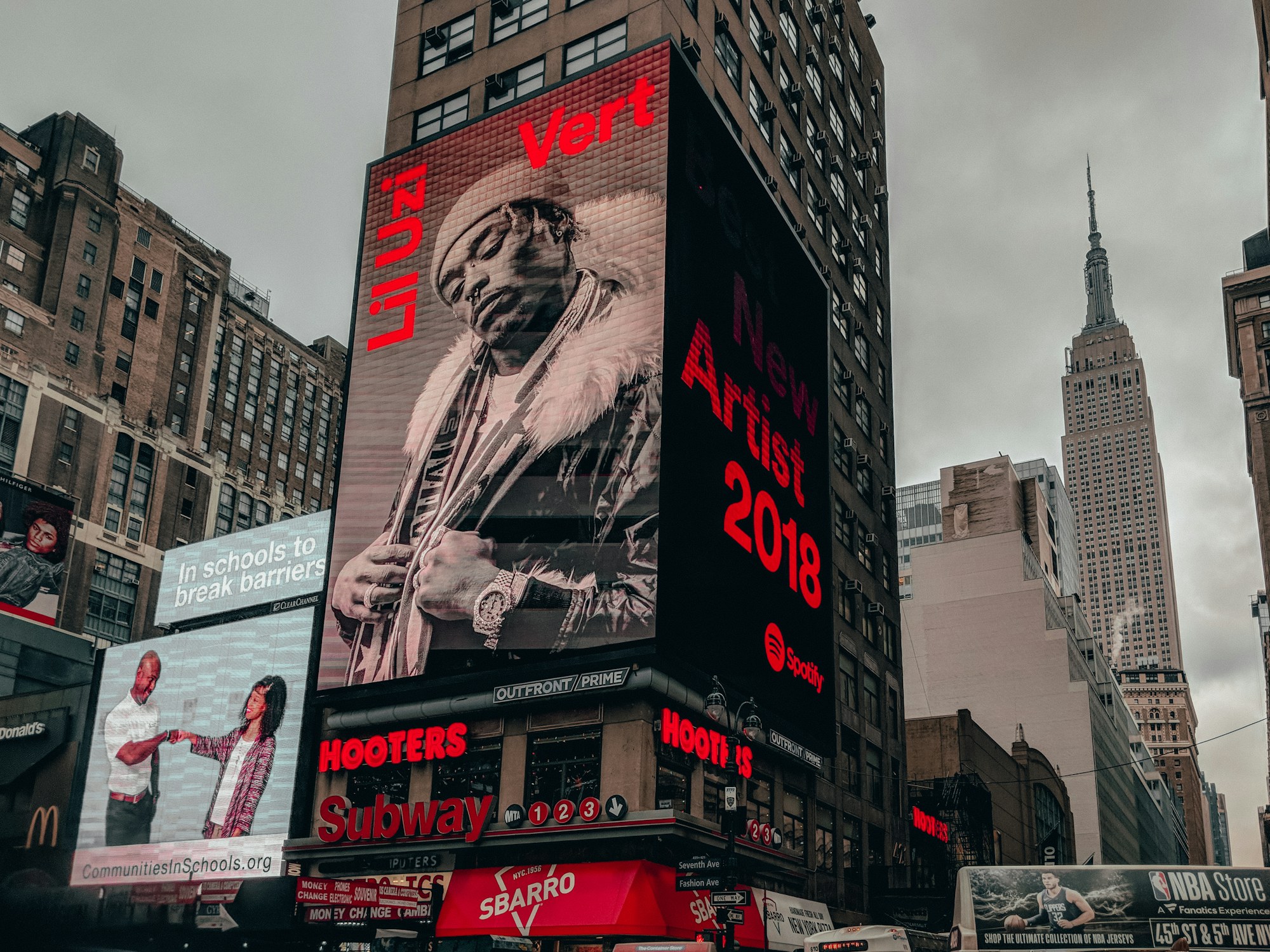 Digital billboards lighting up a city street